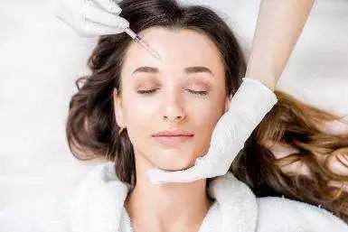 A client receiving Botox wrinkle removal treatment in a clinic in Nepal. A trained medical professional carefully injects Botox into targeted facial areas to smooth fine lines and wrinkles, while the client remains relaxed in a clean, professional environment.
